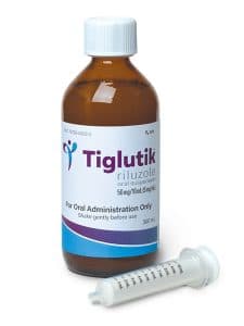 Bottle of Tiglutik (riluzole) with syringe